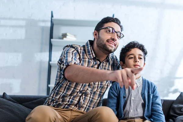 Smiling Jewish Father Pointing Finger Watching Son — Stock Photo, Image