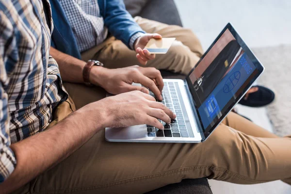 Cropped View Jewish Father Using Laptop Booking Website Son Holding — Stock Photo, Image