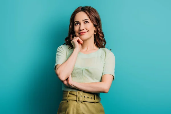 Dreamy Smiling Woman Looking While Standing Blue Background — Stock Photo, Image