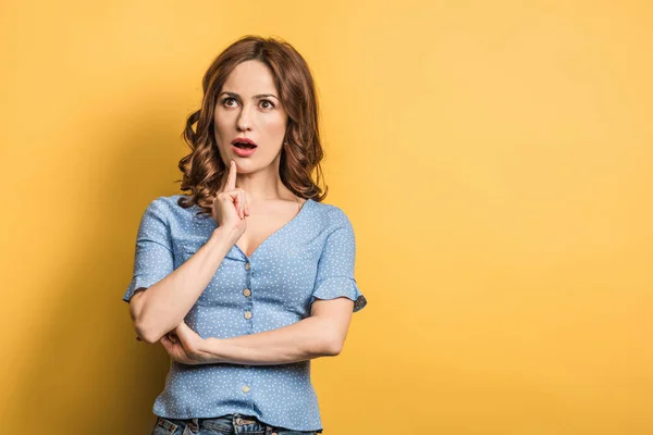 Shocked Girl Looking While Holding Hand Face Yellow Background — 스톡 사진