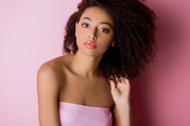 portrait of young curly african american woman on pink clipart