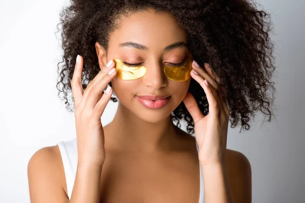 Attractive Smiling African American Girl Golden Eye Patches Isolated Grey — 스톡 사진