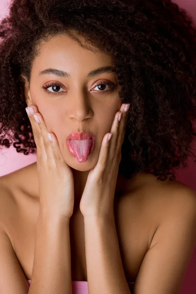 Portrait Happy Curly African American Girl Sticking Tongue Out Pink — Stock Photo, Image