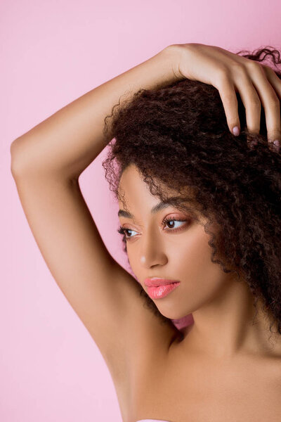 portrait of attractive african american girl, isolated on pink