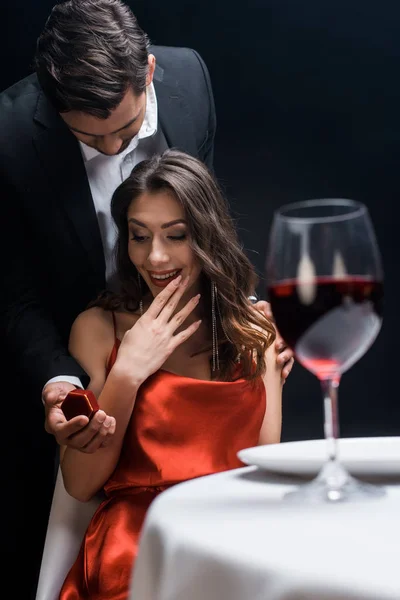 Handsome Man Presenting Box Jewelry Exited Woman Romantic Dinner Isolated — 스톡 사진