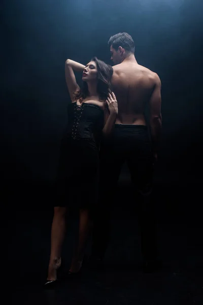 Full Length Sexy Woman Standing Back Muscular Man Black Background — 스톡 사진