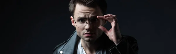 Concentrated Stylish Brutal Man Biker Jacket Touching Eyeglasses Looking Camera — Stock Photo, Image