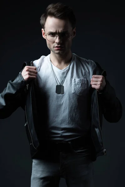 Stylish Brutal Man Holding Biker Jacket Isolated Black — 스톡 사진