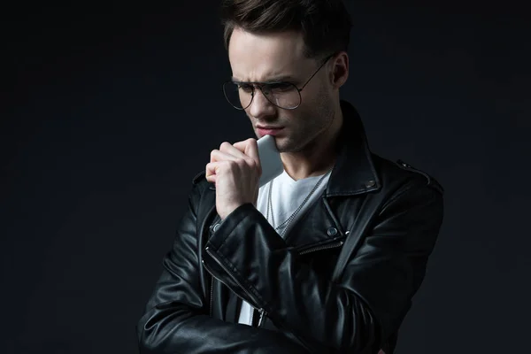 Worried Stylish Man Leather Jacket Smartphone Isolated Black — Stock Photo, Image