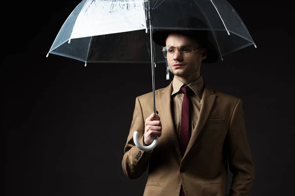 Elegant Man Beige Suit Hat Eyeglasses Holding Umbrella Isolated Black — 스톡 사진