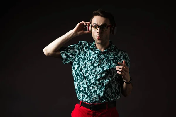 Shocked Fashionable Man Eyeglasses Listening Music Headphones Isolated Black — Stock Photo, Image
