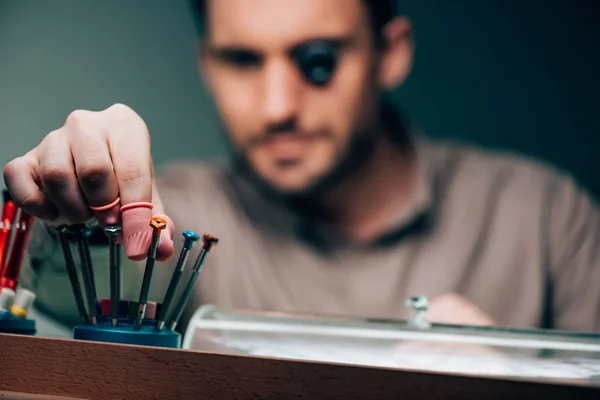 Selective Focus Watchmaker Eyeglass Loupe Taking Screwdriver — Stock Photo, Image