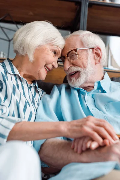 Selective Focus Senior Couple Smiling Each Other While Holding Hands — 스톡 사진