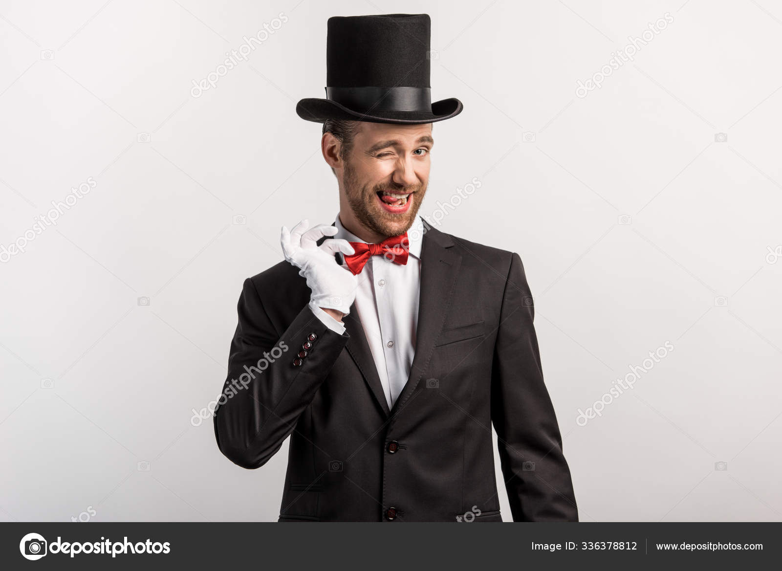 Emotional Magician Winking Adjusting Bow Tie Isolated Grey Stock Photo ...