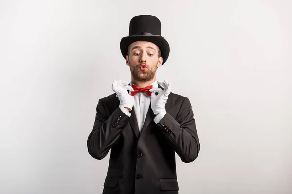 Emotional Magician Adjusting Red Bow Tie Isolated Grey — Stock Photo, Image