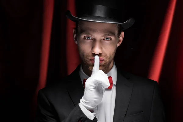 Magician Showing Silence Symbol Circus Red Curtains — Stock Photo, Image