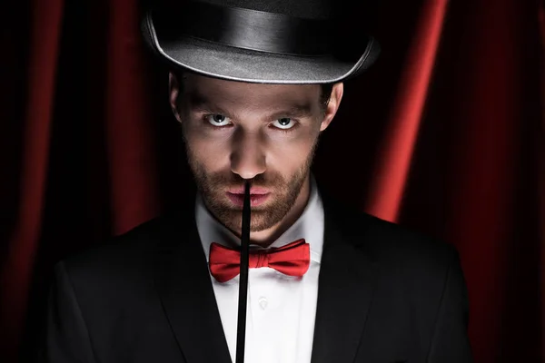Confident Magician Suit Hat Holding Wand Circus Red Curtains — Stock Photo, Image