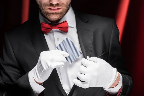 Cropped View Magician Holding Playing Card Circus Red Curtains — Stock Photo, Image