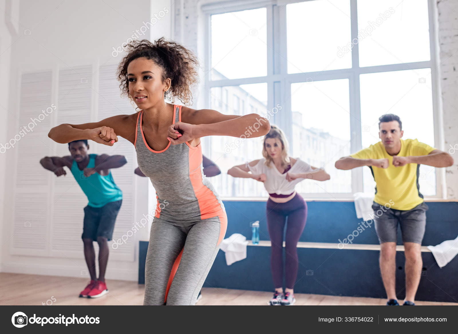 Selective Focus African American Trainer Leaning Multiethnic