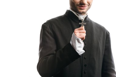 cropped view of catholic priest showing holy cross on his necklace isolated on white
