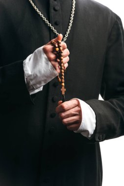 partial view of catholic priest holding wooden rosary beads isolated on white