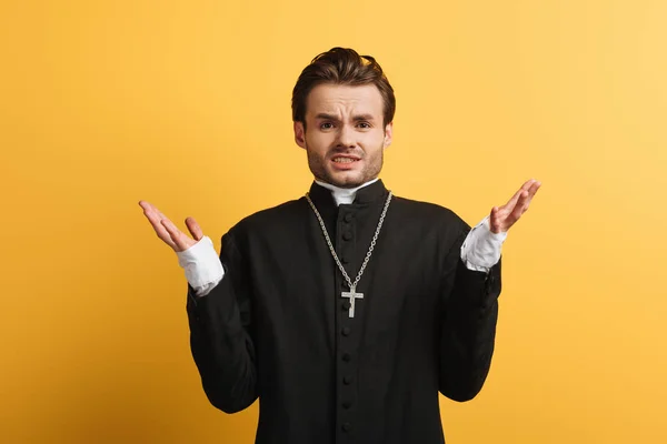 Discouraged Catholic Priest Showing Shrug Gesture Camera Isolated Yellow — 图库照片