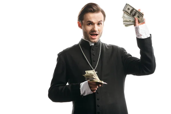 Excited Catholic Priest Looking Camera While Showing Dollar Banknotes Isolated — 스톡 사진