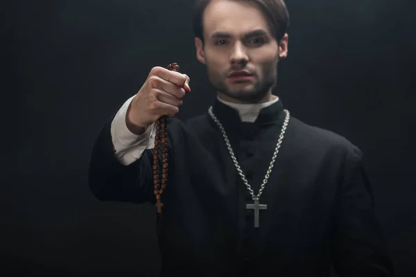 Selective Focus Young Confident Catholic Priest Holding Wooded Rosary Beads — Stock Photo, Image