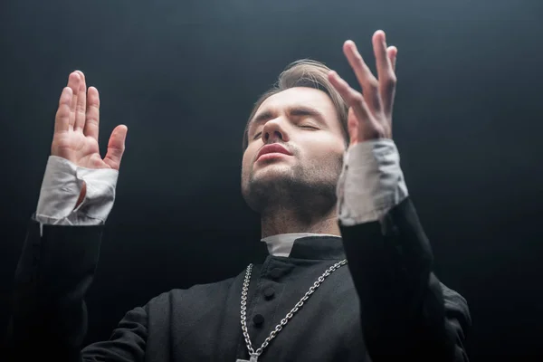 Low Angle View Young Concentrated Catholic Priest Praying Closed Eyes — Stock Photo, Image