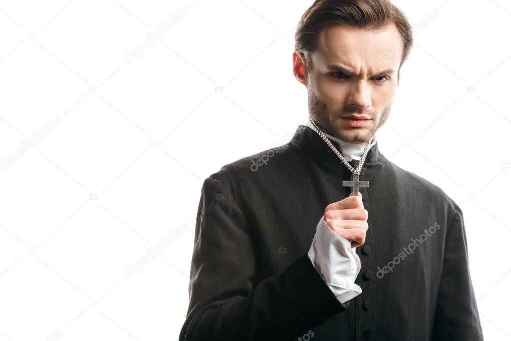 serious, strict catholic priest showing holy cross on his necklace isolated on white