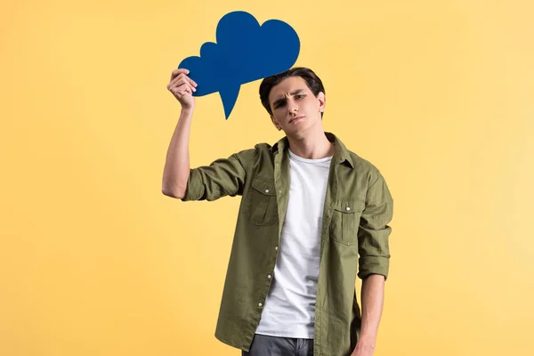 Emotional Sad Man Holding Blue Cloud Speech Bubble Isolated Yellow — Stock Photo, Image