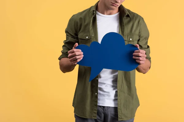 Cropped View Man Holding Blue Cloud Speech Bubble Isolated Yellow — 图库照片
