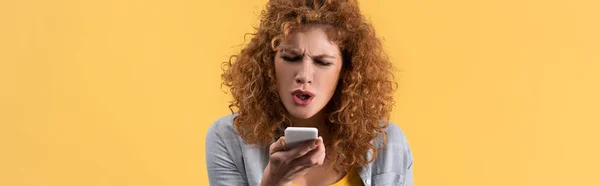 Panoramic Shot Angry Redhead Woman Yelling Smartphone Isolated Yellow — Stock Photo, Image
