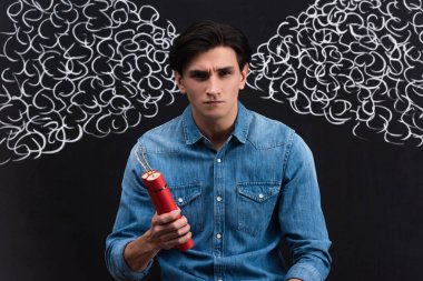 angry young man holding dynamite, with steam drawing on chalkboard clipart