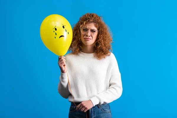 Upset Girl Holding Yellow Balloon Crying Face Isolated Blue — Stockfoto