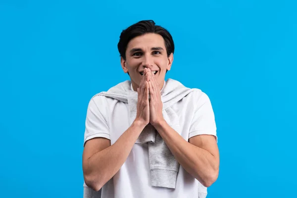 Portrait Surprised Young Man Holding Hands Together Isolated Blue — Stock fotografie