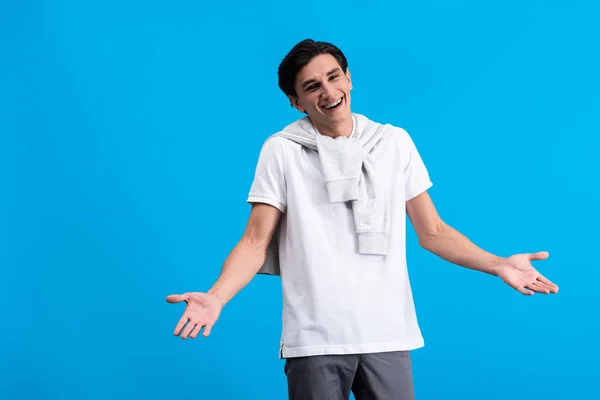 Portrait Happy Young Man Shrug Gesture Isolated Blue — Stock fotografie