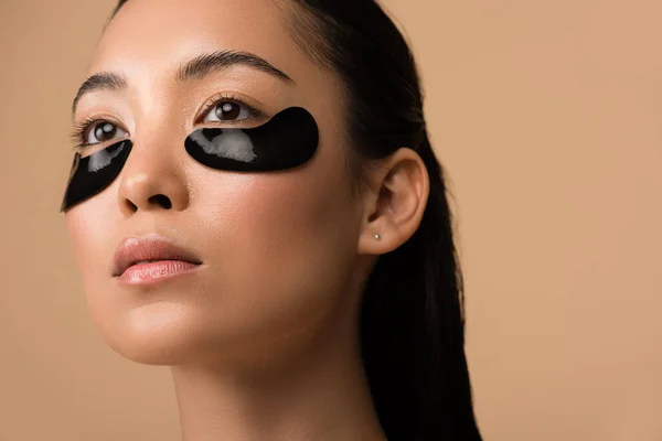 Beautiful Asian Girl Black Hydrogel Eye Patches Eyes Isolated Beige — Stock Photo, Image