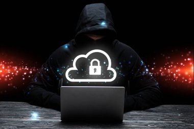 hacker in hood using laptop near cloud with padlock on black  clipart