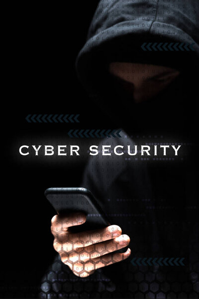 selective focus of hacker using smartphone near cyber security lettering on black 