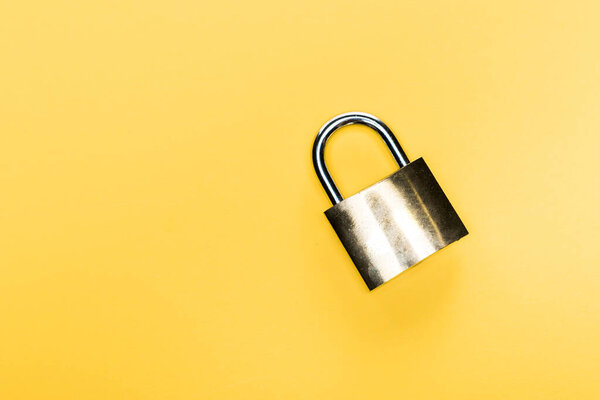 top view of metallic locker isolated on yellow