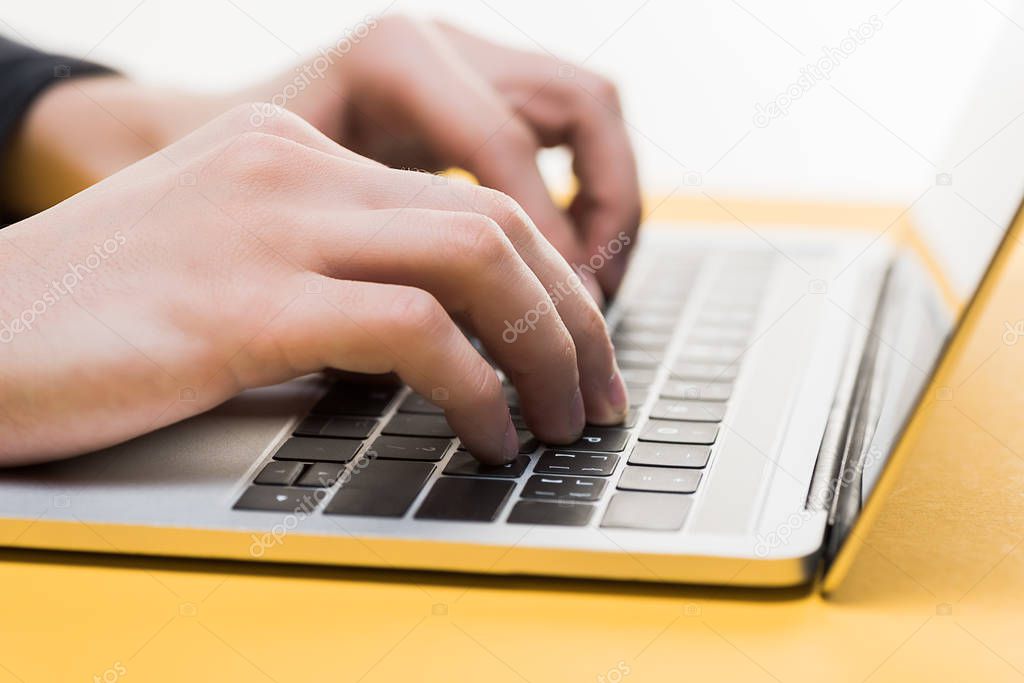 close up of hacker using laptop isolated on white 