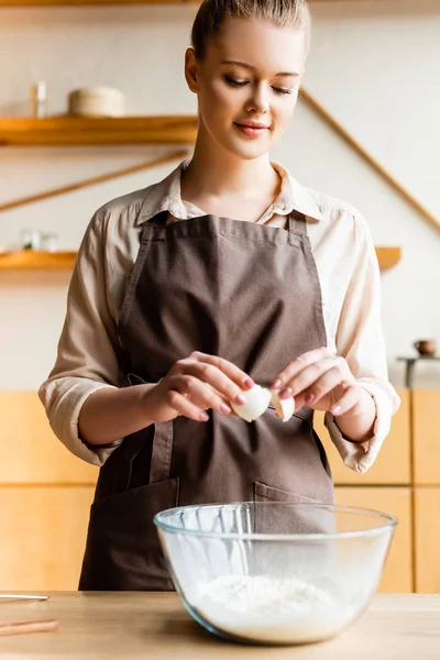 Attractive Woman Apron Adding Egg Bowl Flour — Stock Photo, Image