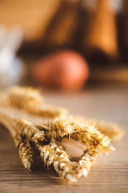 selective focus of wheat on wooden desk 