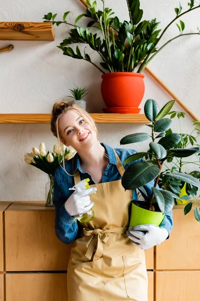 Cheerful Young Woman Holding Spray Bottle Green Plant — 스톡 사진