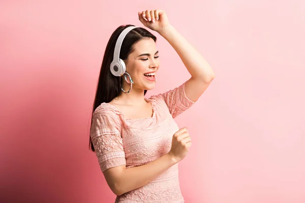 Happy Girl Wireless Headphones Dancing Singing Pink Background — Stock Photo, Image