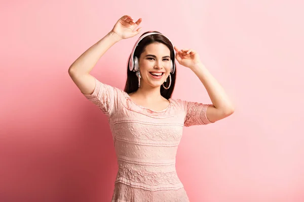 Cheerful Girl Wireless Headphones Dancing Open Arms Pink Background — Stock Photo, Image