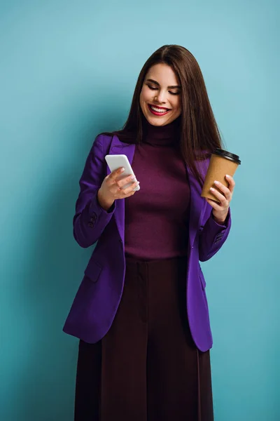Happy Girl Chatting Smartphone While Holding Coffee Blue Background — Stock Photo, Image