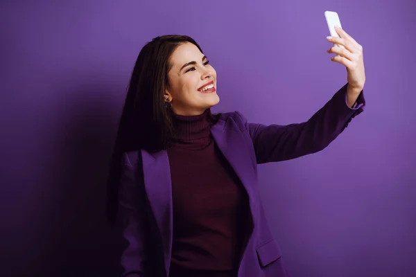 Cheerful Stylish Girl Taking Selfie Smartphone Purple Background — Stock Photo, Image