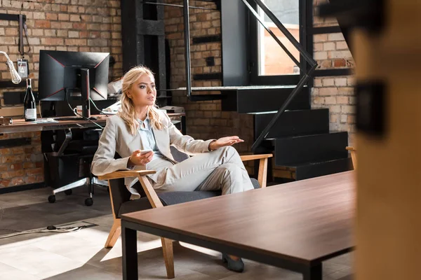 Selective Focus Beautiful Thoughtful Businesswoman Sitting Armchair Open Arm Holding — Stock Photo, Image